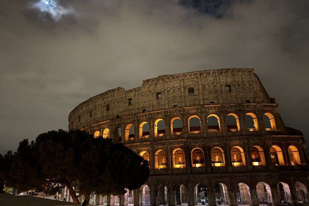 Night view of the gladiator arena, Colosseum against the moon light