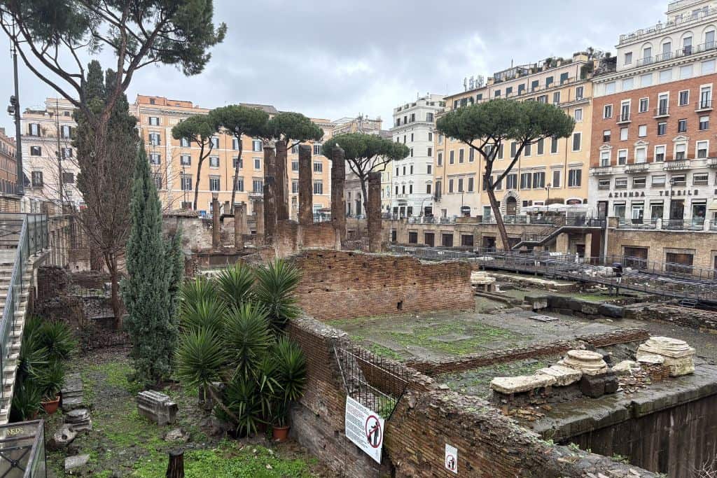 Ruins of pillars, and walls within a city square